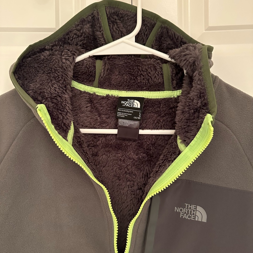 The North Face jacket. New never worn. Youth boy size L (14-16).